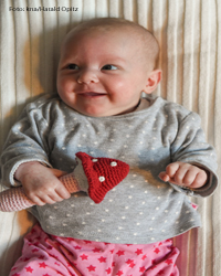 Ein Kind lacht. Foto: kna/Harald Oppitz 